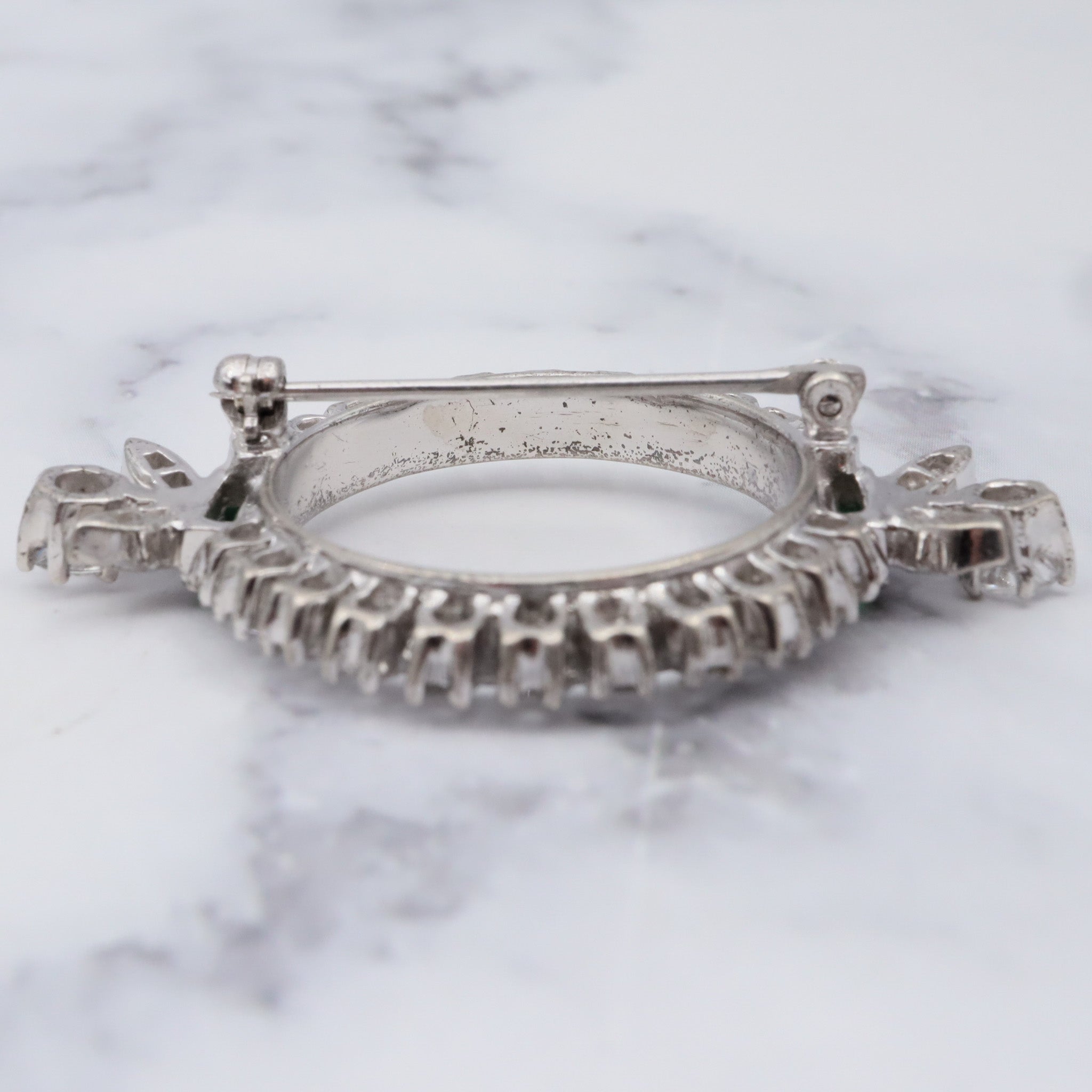 Antique Art Deco rhodium plated sterling, quartz & synthetic emerald circle frame brooch